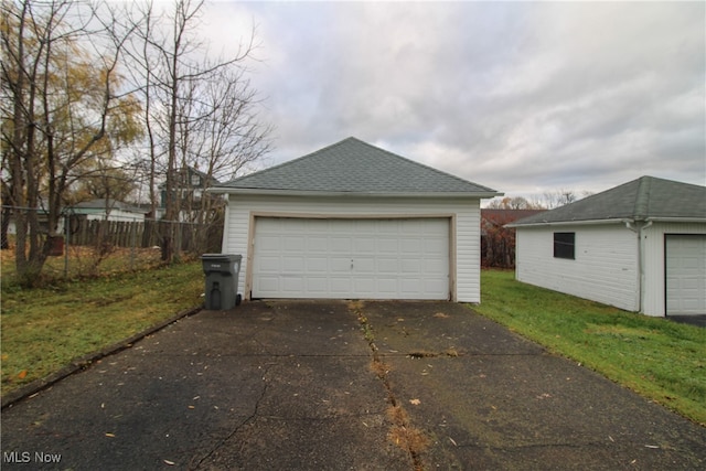 garage featuring a yard