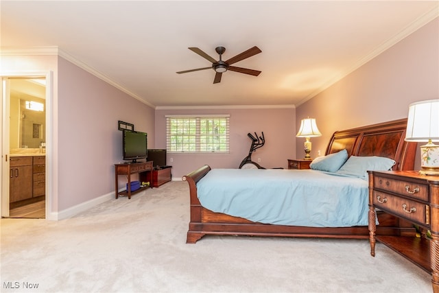 bedroom featuring ensuite bathroom, ceiling fan, ornamental molding, and light carpet