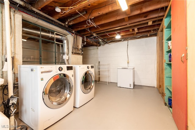 clothes washing area with washer and dryer