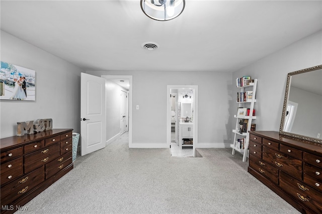 carpeted bedroom featuring connected bathroom