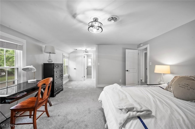 bedroom featuring light colored carpet