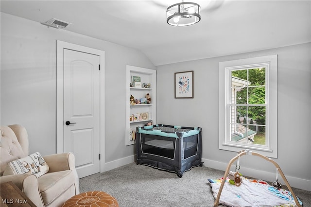 interior space featuring lofted ceiling and light carpet