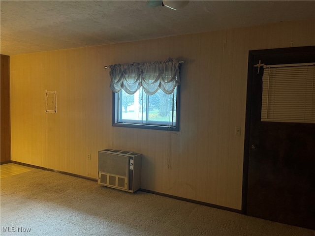 carpeted spare room with heating unit