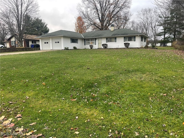 ranch-style house featuring a garage and a front lawn