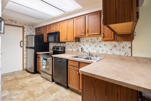 kitchen with sink and black appliances