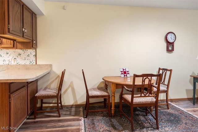 dining space featuring dark hardwood / wood-style floors