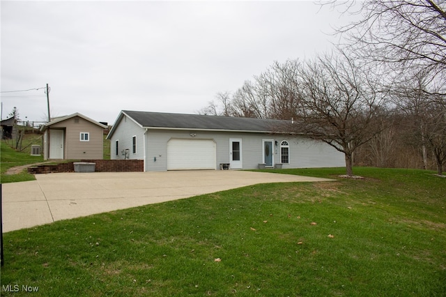 single story home featuring a garage and a front lawn