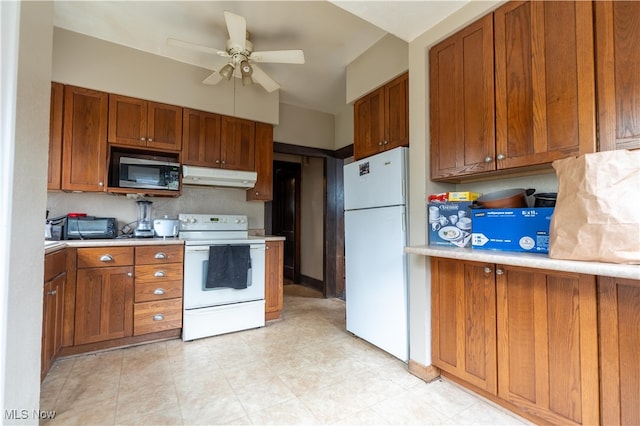 kitchen featuring white appliances and ceiling fan