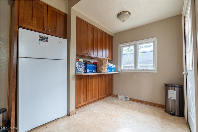 kitchen featuring white fridge