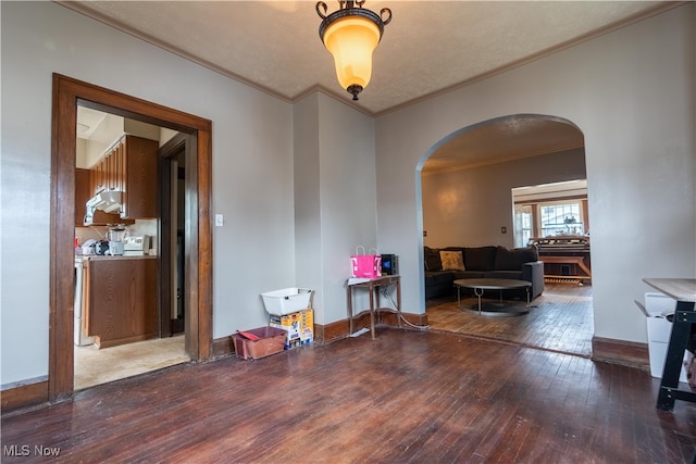 interior space featuring hardwood / wood-style flooring and ornamental molding