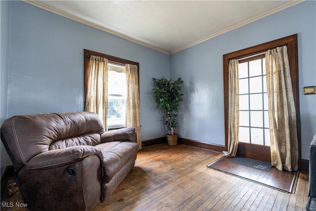 sitting room featuring plenty of natural light, hardwood / wood-style floors, and crown molding