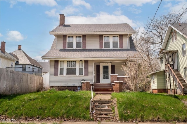 view of front of house with a chimney, stairs, fence, covered porch, and roof with shingles