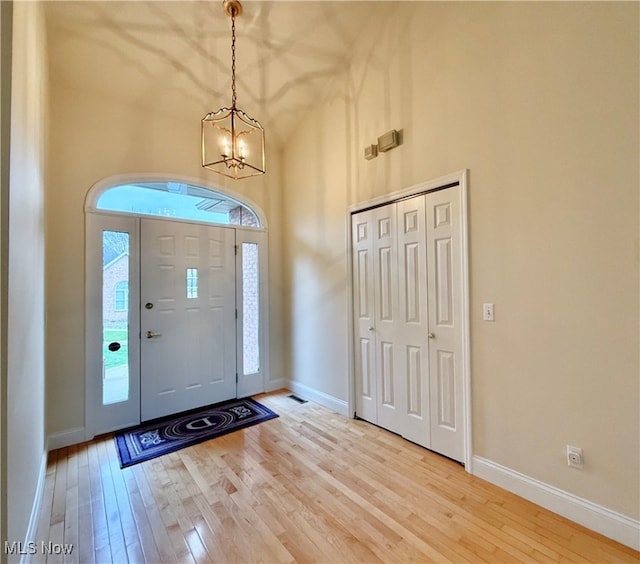 entrance foyer featuring a chandelier and hardwood / wood-style floors