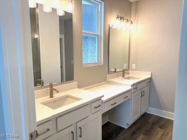 bathroom with vanity and hardwood / wood-style floors