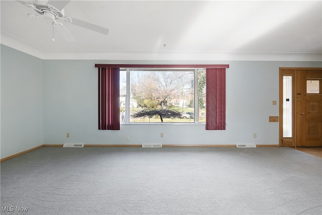 unfurnished living room featuring carpet floors and ceiling fan