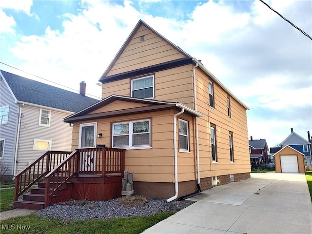 view of front facade with an outdoor structure and a garage