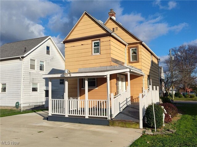 975 Broad St, Conneaut, OH 44030 - back of house with covered porch and a chimney