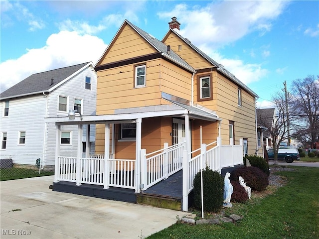 975 Broad St, Conneaut, OH 44030 - rear view of property with covered porch and a chimney