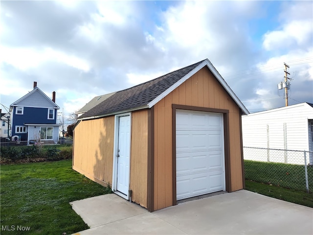 garage with a yard