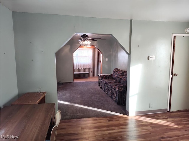 975 Broad St, Conneaut, OH 44030 - additional living space with wood finished floors, radiator, and ceiling fan