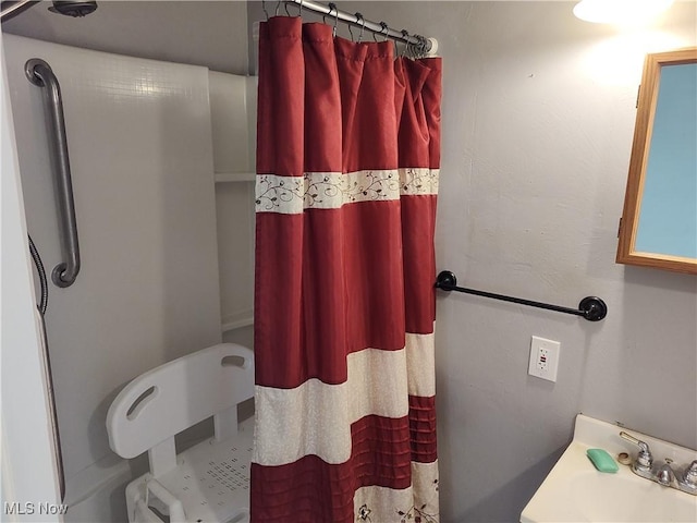 975 Broad St, Conneaut, OH 44030 - bathroom featuring a shower with shower curtain and a sink