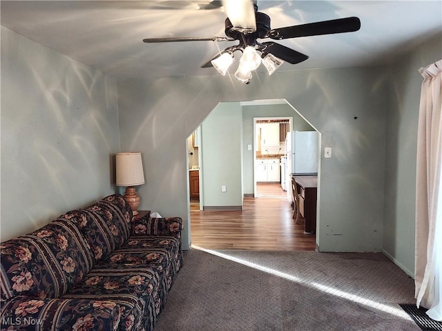 975 Broad St, Conneaut, OH 44030 - carpeted living area featuring ceiling fan and baseboards