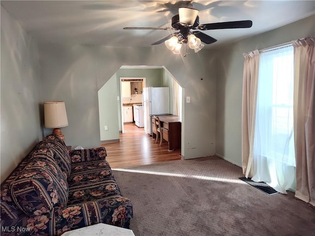 975 Broad St, Conneaut, OH 44030 - living area with ceiling fan and light colored carpet