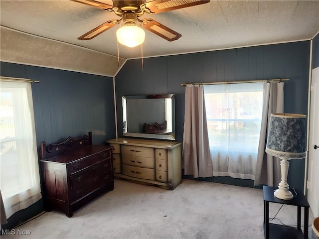 975 Broad St, Conneaut, OH 44030 - bedroom with multiple windows, carpet, a ceiling fan, and vaulted ceiling