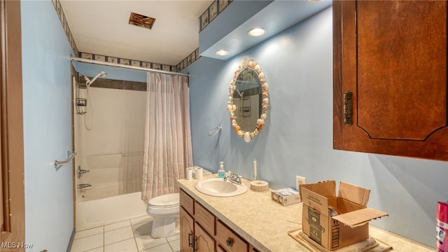 full bathroom with tile patterned flooring, vanity, toilet, and shower / tub combo