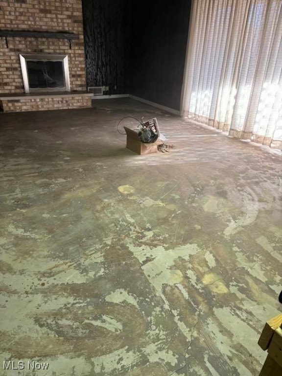 unfurnished living room with a fireplace