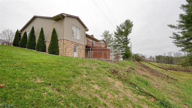 view of home's exterior with a lawn