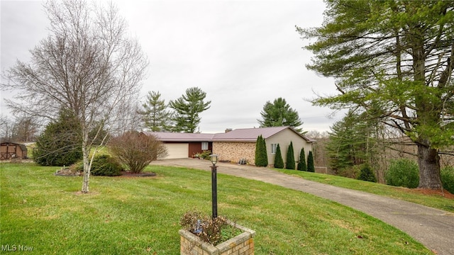 view of front facade with a garage and a front lawn