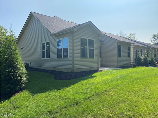 view of property exterior featuring a yard