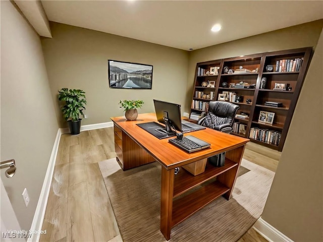 office with light hardwood / wood-style floors