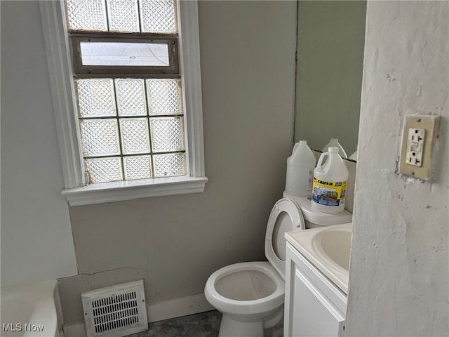 bathroom featuring vanity and toilet