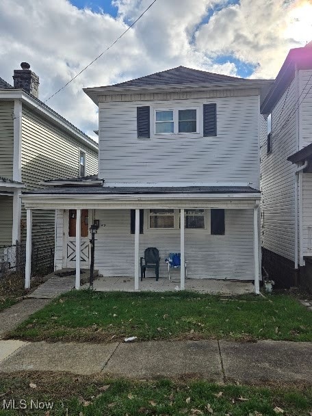 rear view of house with a patio area