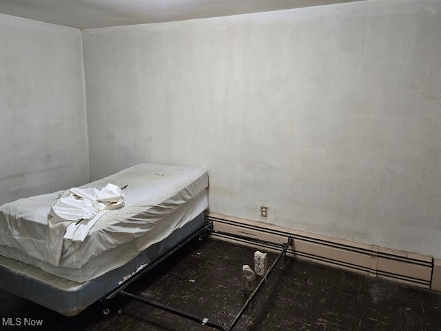 bedroom featuring a baseboard radiator