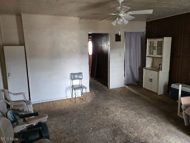 interior space featuring carpet floors and ceiling fan