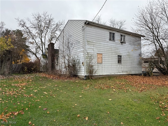 view of property exterior featuring a yard