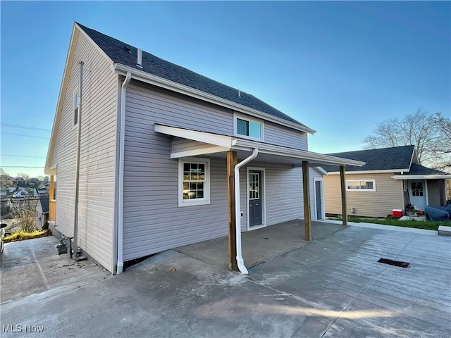 back of house with a patio area