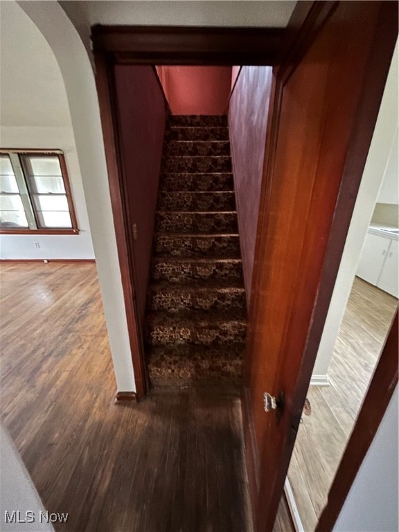 stairway featuring hardwood / wood-style floors