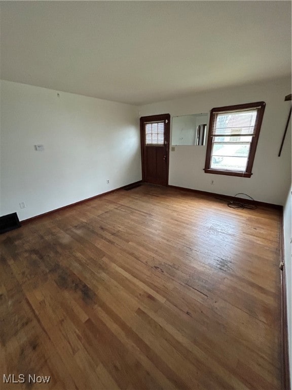 interior space with a wealth of natural light and wood-type flooring