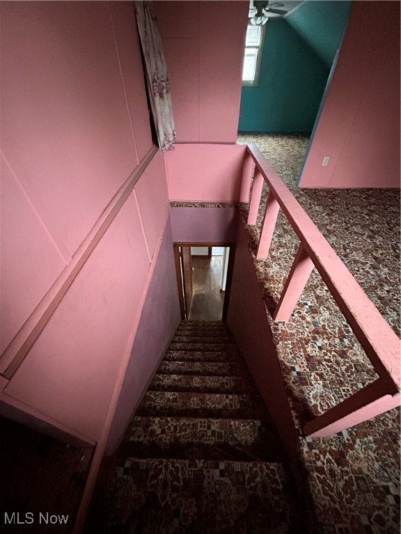 stairway with ceiling fan