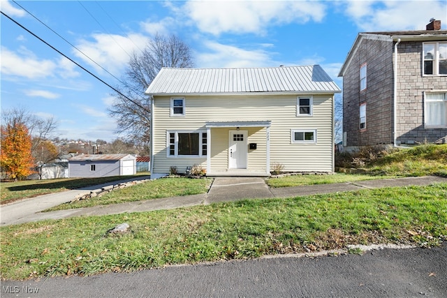 view of front of home with a front lawn