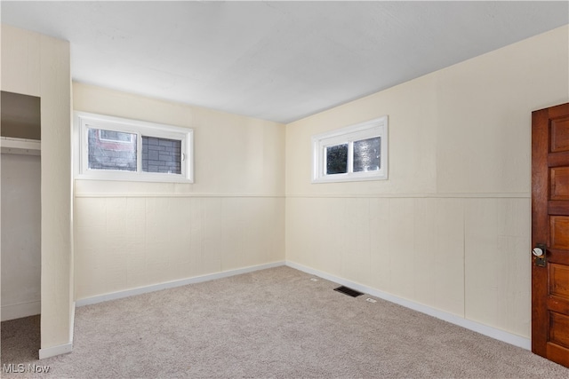 basement with light colored carpet