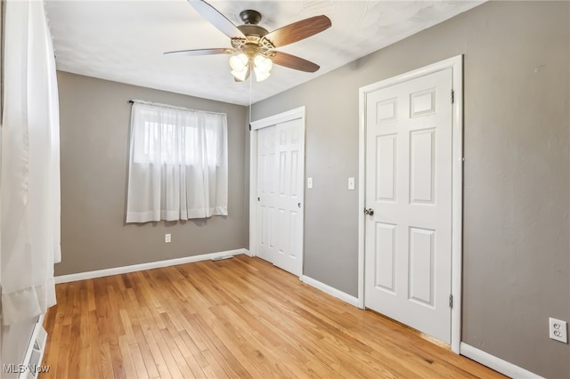 unfurnished bedroom with light hardwood / wood-style flooring and ceiling fan