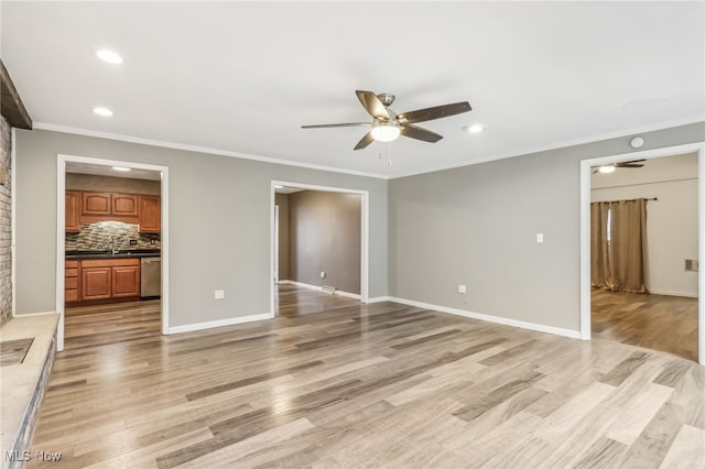 unfurnished living room featuring crown molding, ceiling fan, and light wood-type flooring