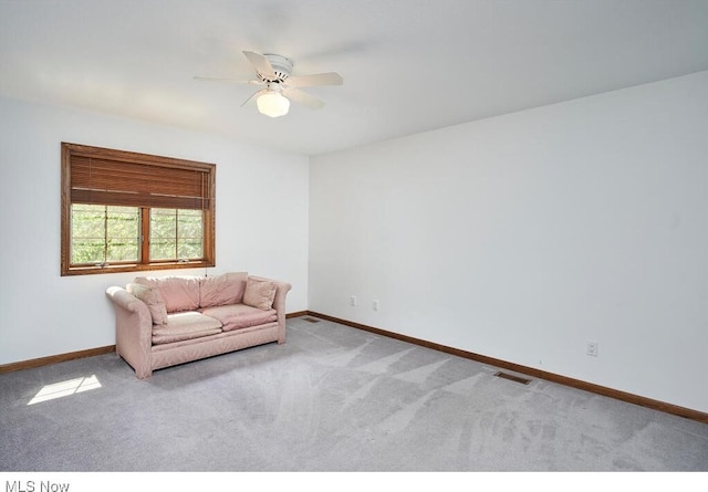 unfurnished room with light carpet and ceiling fan