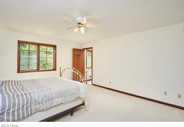 bedroom featuring ceiling fan and light colored carpet