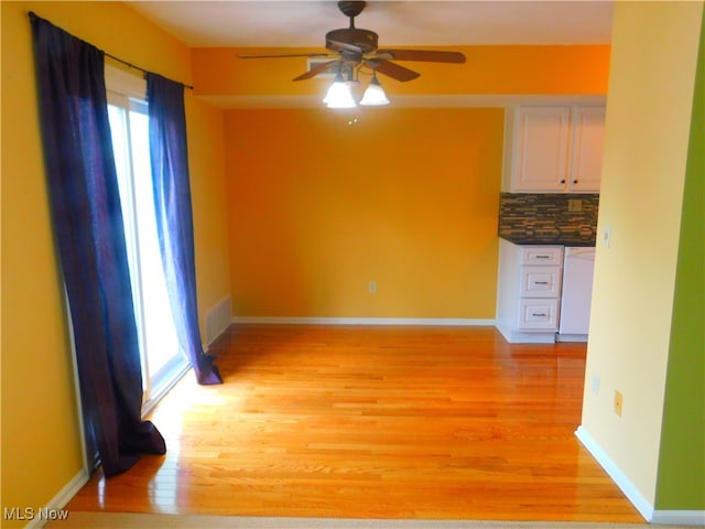 unfurnished room with light hardwood / wood-style flooring and ceiling fan